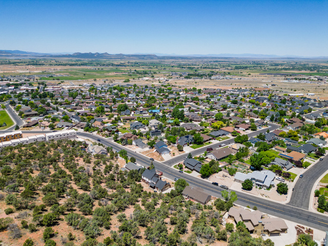 790 East Fiddlers Canyon Road Cedar City, UT 84721 - Photo 32 of 35 Aerial perspective showcasing a residential community with varied rooflines and established landscaping