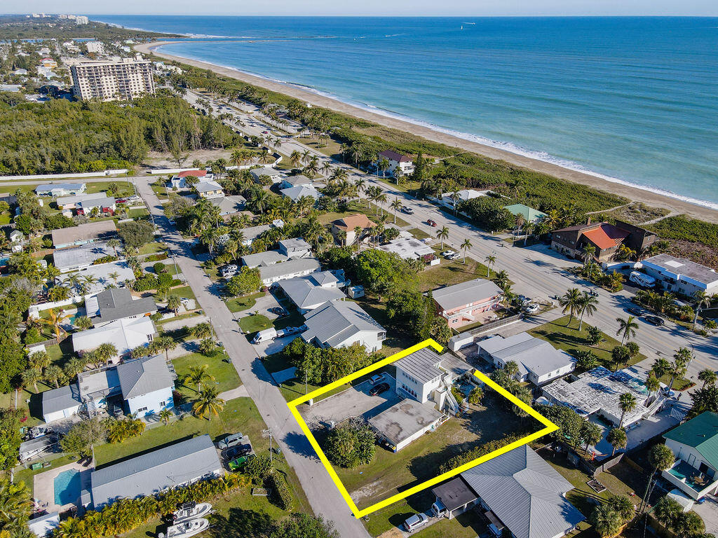 1140 Hernando Street Fort Pierce, FL 34949 - Photo 3 of 37 an aerial view of residential houses with outdoor space