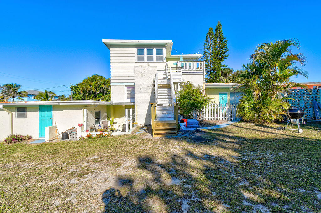 1140 Hernando Street Fort Pierce, FL 34949 - Photo 7 of 37 a view of a house with backyard and sitting area