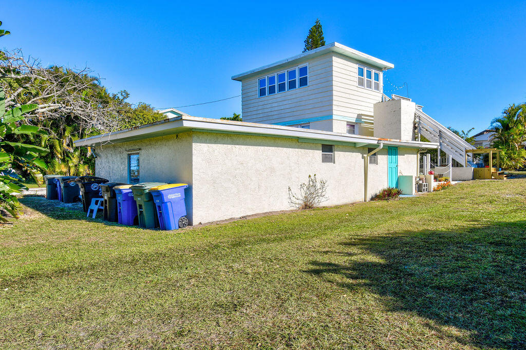 1140 Hernando Street Fort Pierce, FL 34949 - Photo 8 of 37 a view of a house with a yard