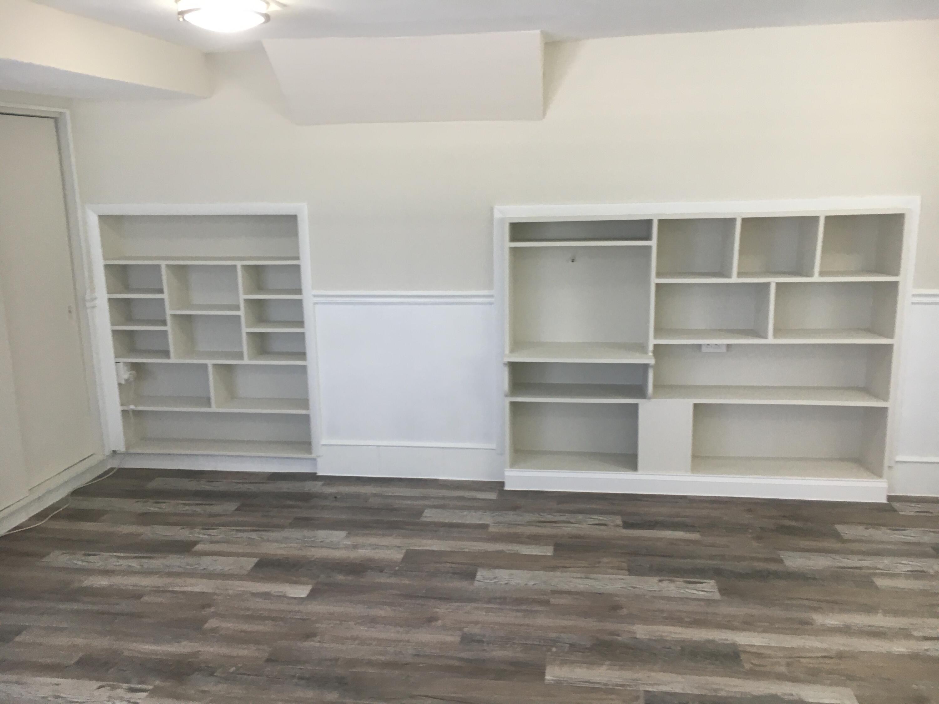 1140 Hernando Street Fort Pierce, FL 34949 - Photo 10 of 37 a view of a room with wooden floor and closet