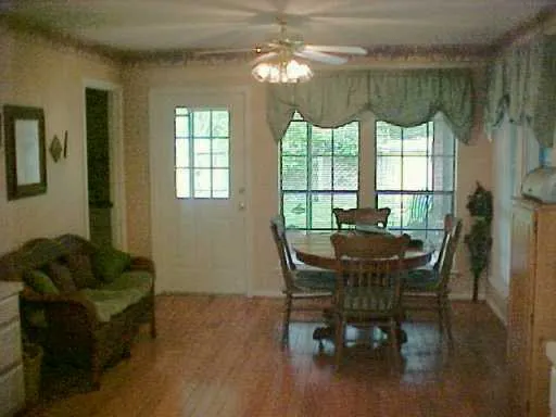 a view of a dining room with furniture window and outside view
