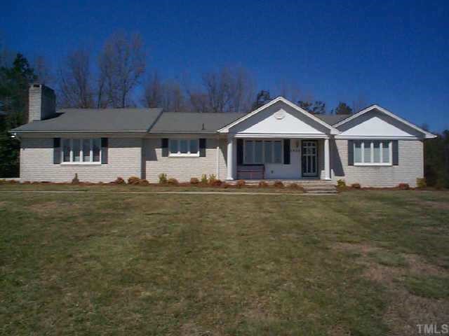 1025 Ridge Road Roxboro, NC 27573 - Photo 1 of 1 a front view of a house with a yard