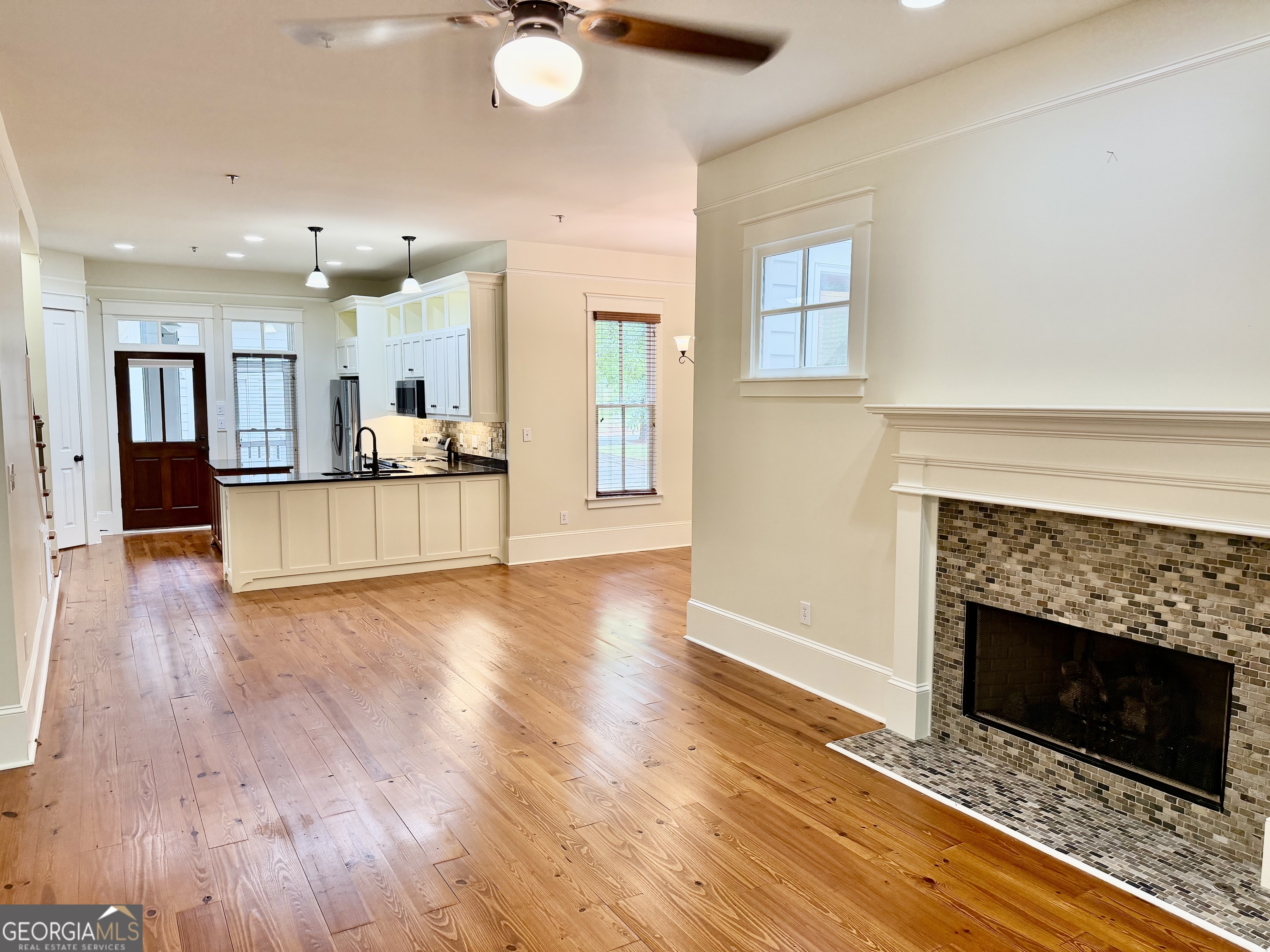 25 Charter Oak Drive Athens, GA 30607 - Photo 8 of 19 a view of a living room with a fireplace and wooden floor