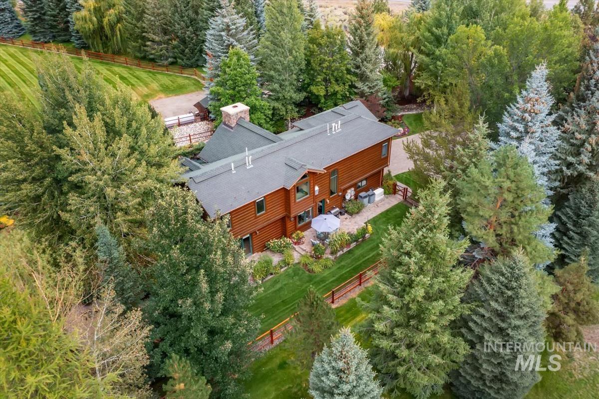 106 Hidden Hollow Road Hailey, ID 83333 - Photo 18 of 49 Wood-sided residence with multiple gables and a stone chimney