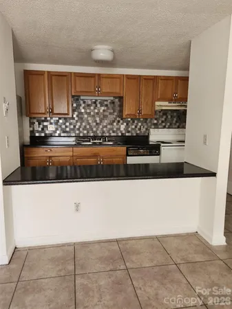 a view of kitchen island and cabinets