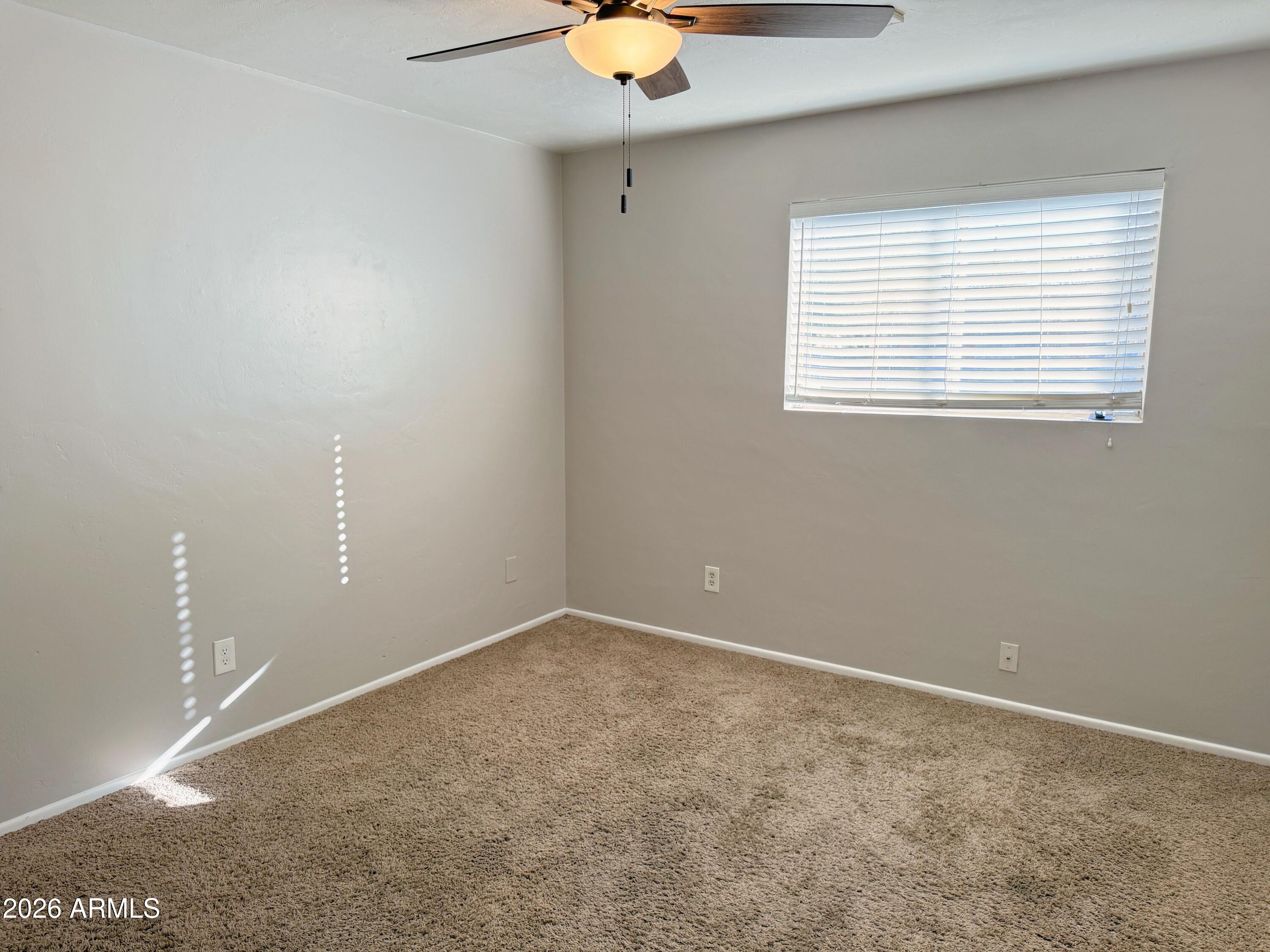 1220 West Romo Jones Street Tempe, AZ 85281 - Photo 15 of 26 an empty room with a window