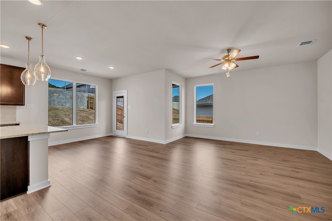 262 Wind Ridge Drive Copperas Cove, TX 76522 - Photo 15 of 30 a view of an empty room with window and wooden floor