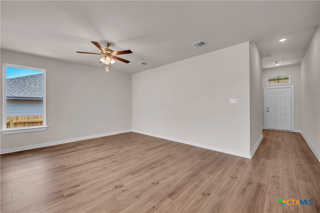 262 Wind Ridge Drive Copperas Cove, TX 76522 - Photo 17 of 30 wooden floor in an empty room with a window