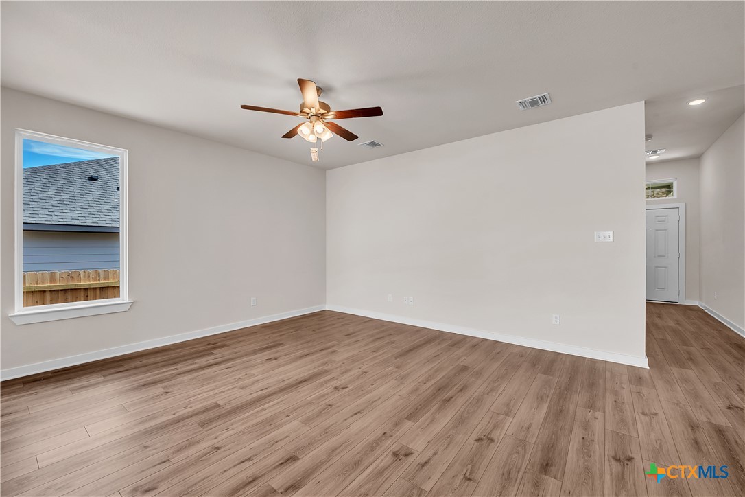 262 Wind Ridge Drive Copperas Cove, TX 76522 - Photo 24 of 30 wooden floor in an empty room with a window