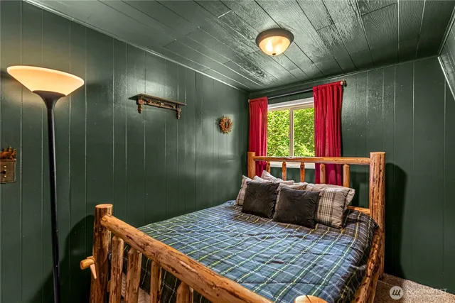 a bedroom with furniture and window