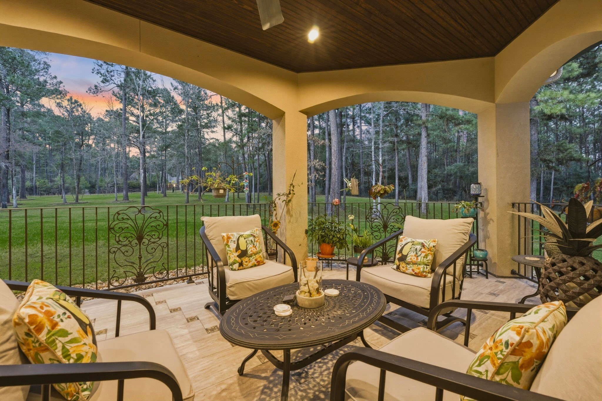 280 Sundog Road Huntsville, TX 77340 - Photo 10 of 50 Additional loggia seating area creates a comfortable spot to relax, visit with guests, or enjoy the peaceful setting.
