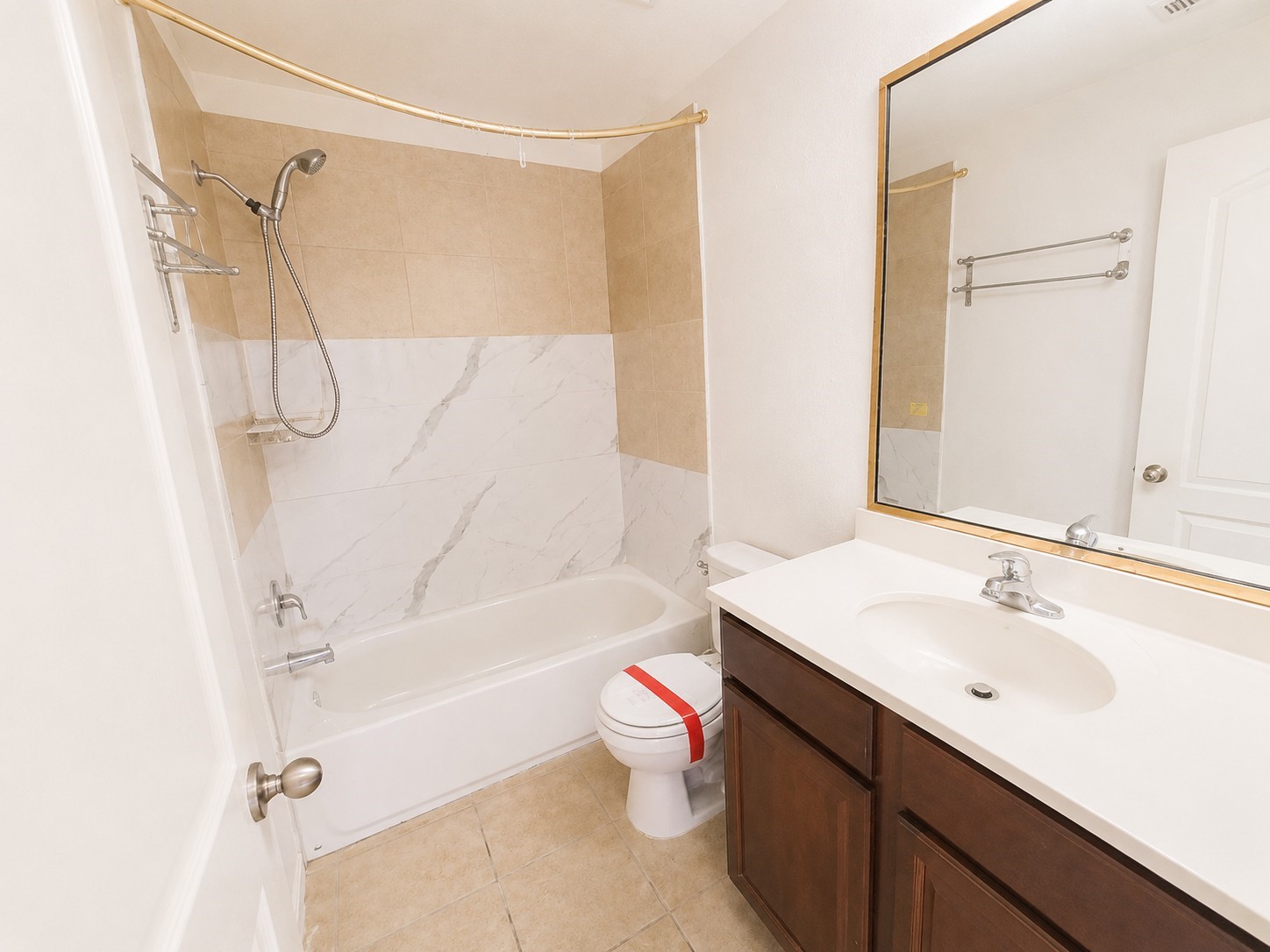 341 Comanche Plains Road La Marque, TX 77568 - Photo 14 of 17 a bathroom with a sink a toilet and a bathtub