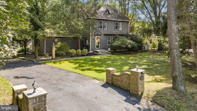 a view of a house with backyard porch and sitting area