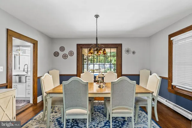 an aerial view of a house with a yard and large trees