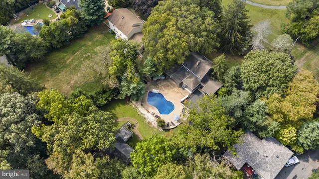 a aerial view of a house with a yard