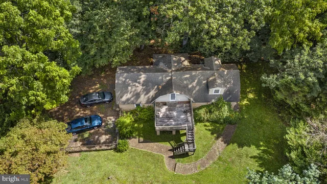 a bedroom with bed and a chandelier