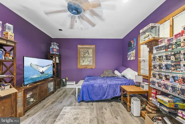 a bedroom with furniture and a window