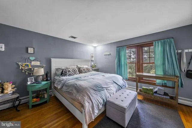 a view of a house with swimming pool and sitting area