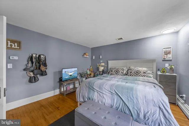 a view of a patio with couches chairs and a potted plant