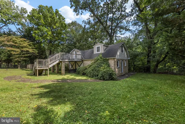 a living room with furniture and a lamp