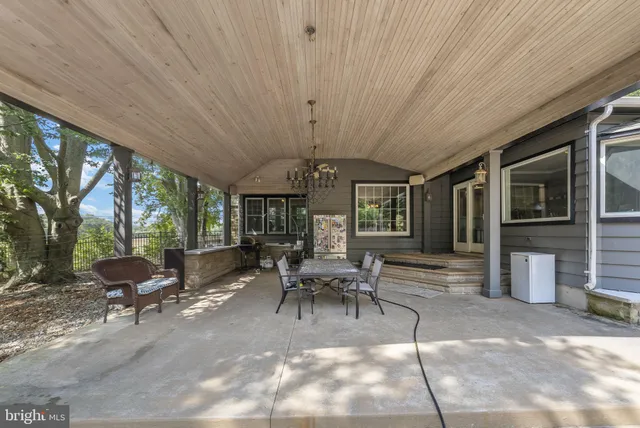 a spacious bedroom with a bed and a window