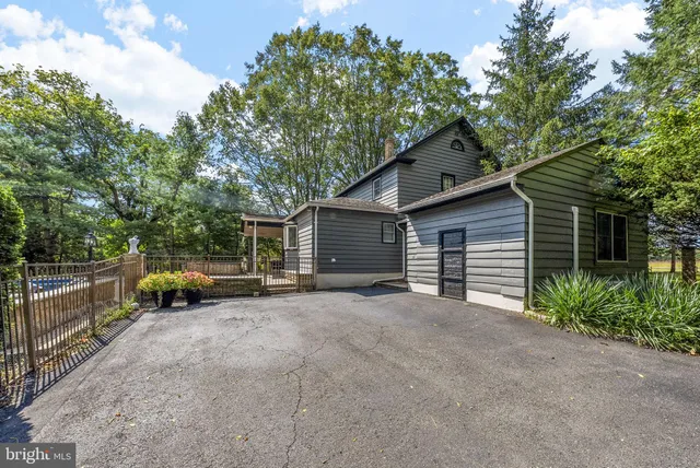 a living room with furniture and a kitchen