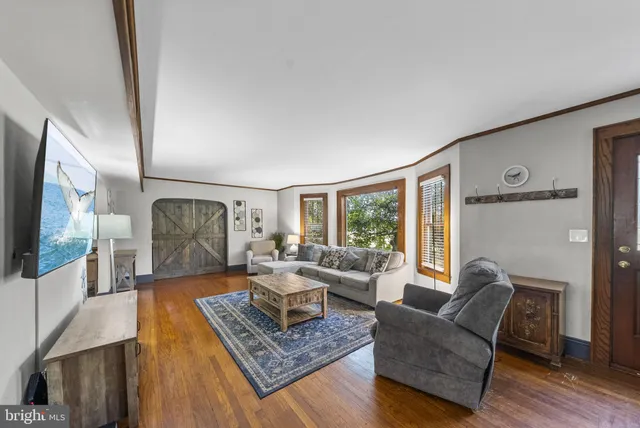 a living room with furniture and a rug