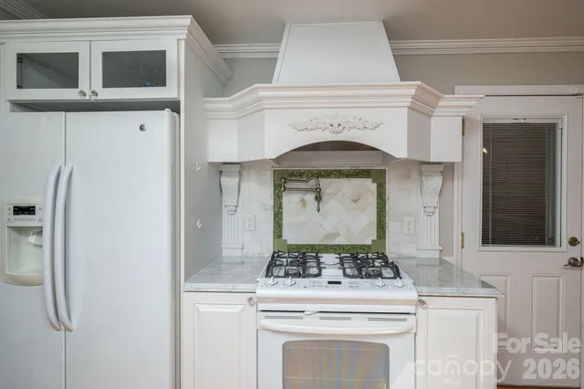 a bathroom with a sink mirror and toilet
