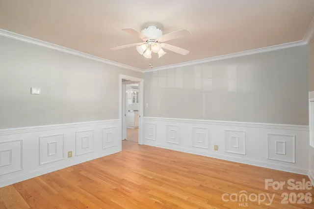 a view of a house with potted plants and a yard