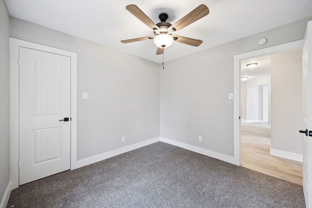 2942 Waterloo Road Pearland, TX 77581 - Photo 15 of 22 wooden floor in an empty room and a window