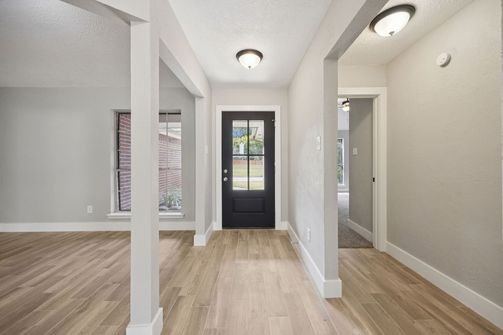 2942 Waterloo Road Pearland, TX 77581 - Photo 10 of 22 wooden floor and windows in a room