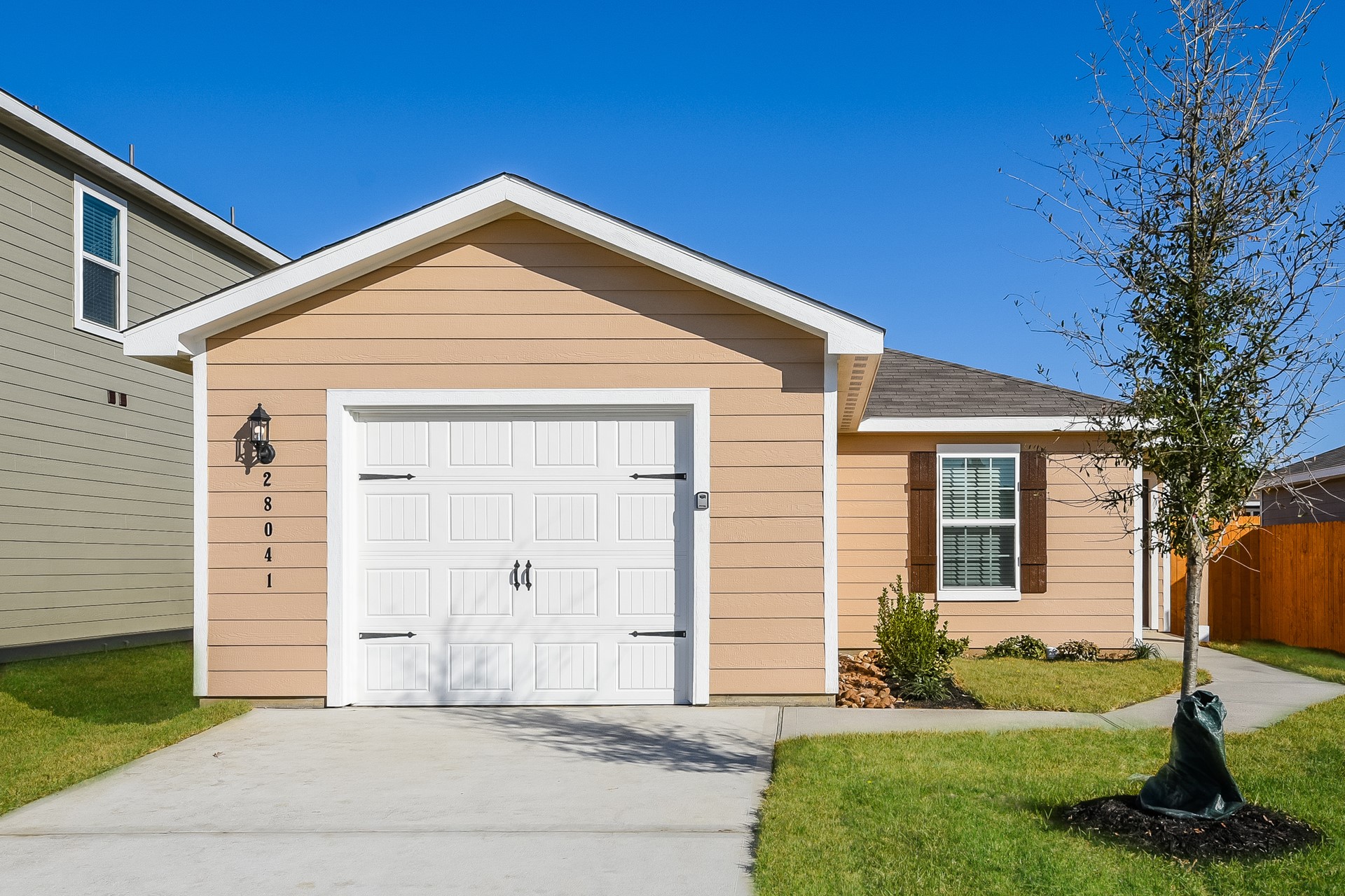 28041 Irving Drive Magnolia, TX 77355 - Photo 1 of 16 a front view of a house with a yard