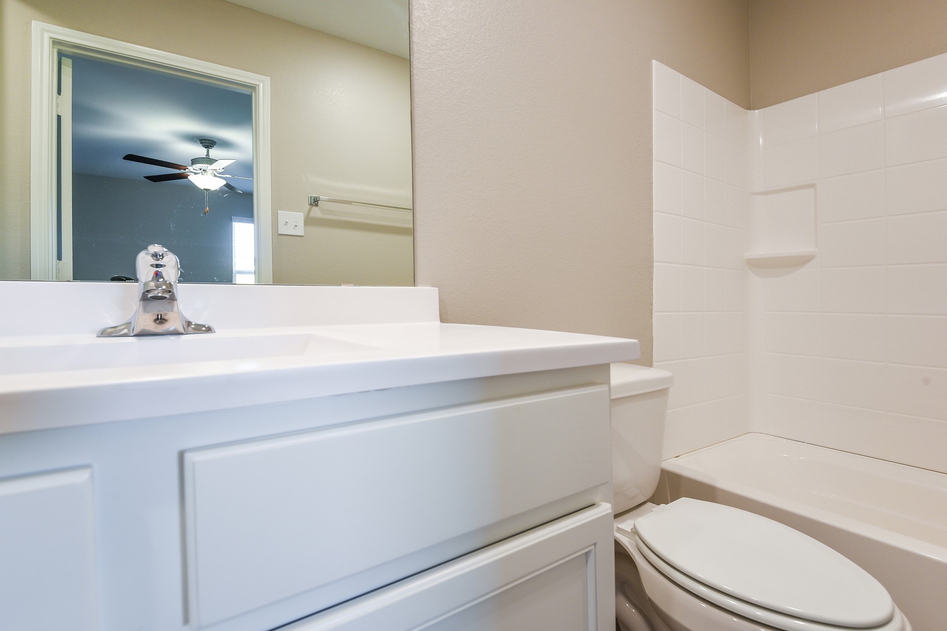 28041 Irving Drive Magnolia, TX 77355 - Photo 13 of 16 a bathroom with a sink a toilet and vanity