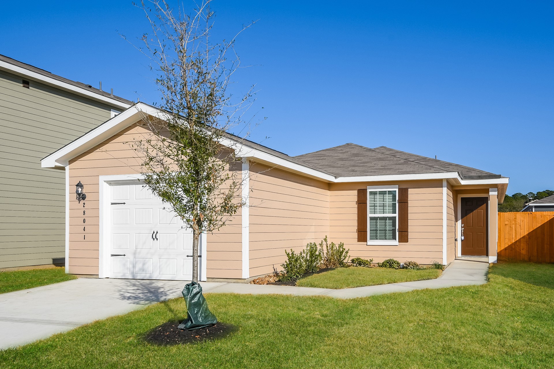 28041 Irving Drive Magnolia, TX 77355 - Photo 2 of 16 a front view of a house with a yard