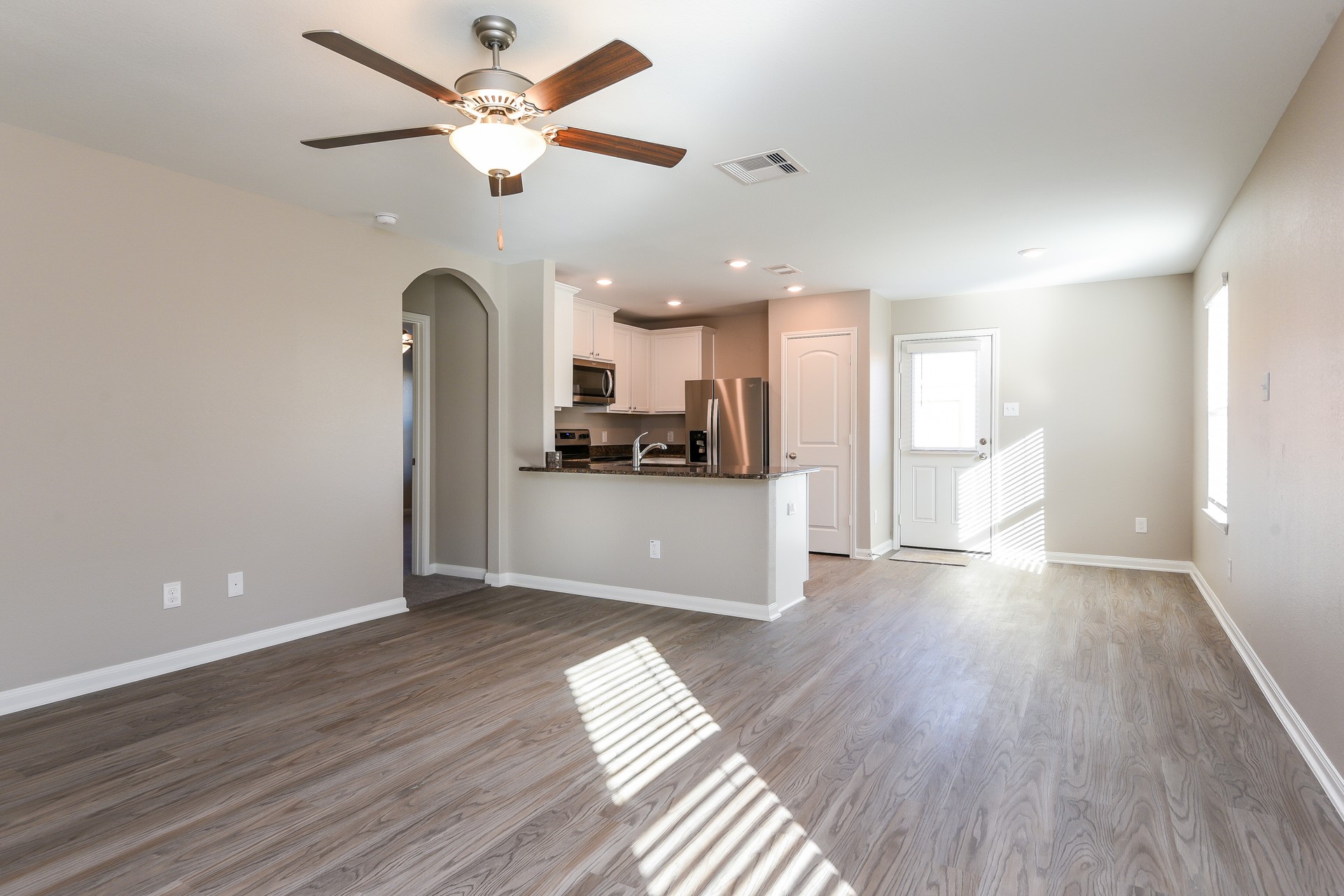 28041 Irving Drive Magnolia, TX 77355 - Photo 3 of 16 a view of a kitchen with a sink and stainless steel appliances