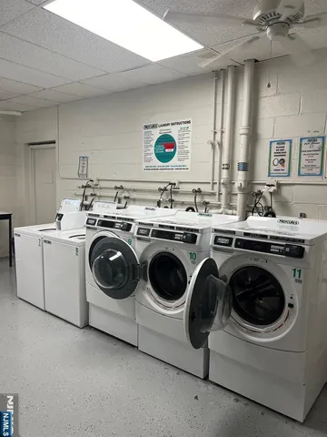 a front view of a building with parking