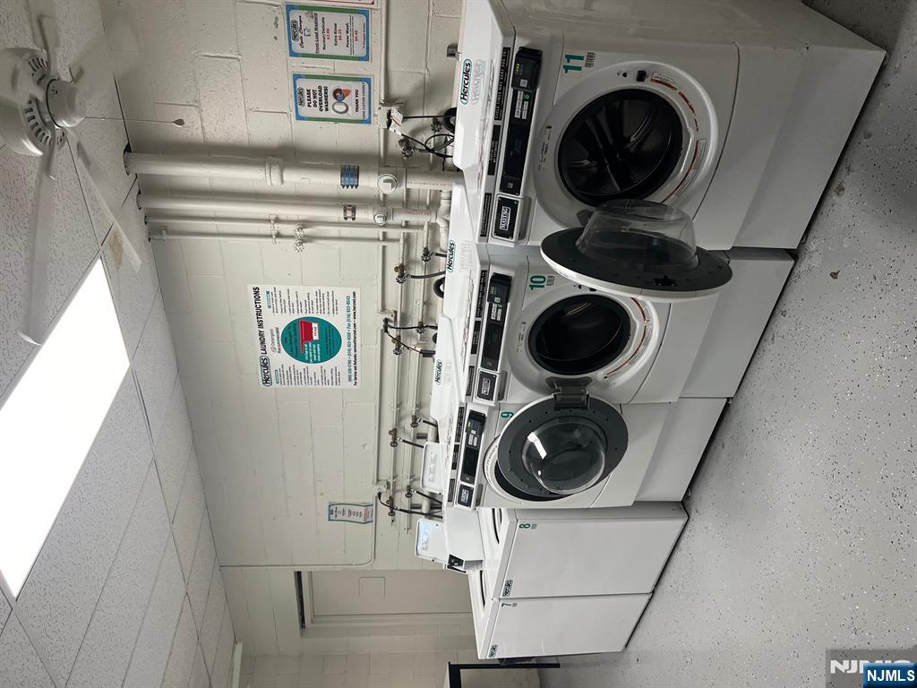 77 Prospect Avenue, Unit 6H Hackensack, NJ 07601 - Photo 13 of 15 a utility room with dryer and washer