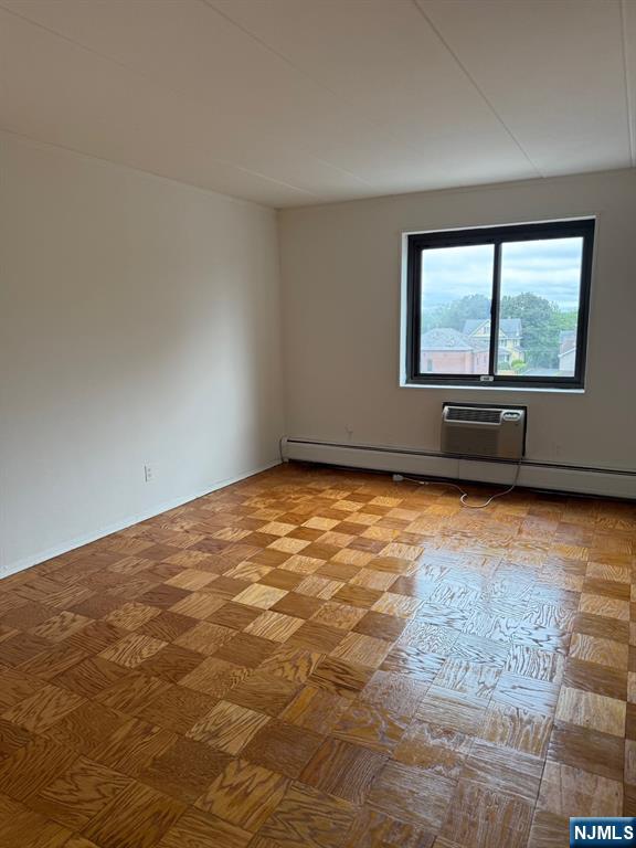 77 Prospect Avenue, Unit 6H Hackensack, NJ 07601 - Photo 6 of 15 an empty room with large window