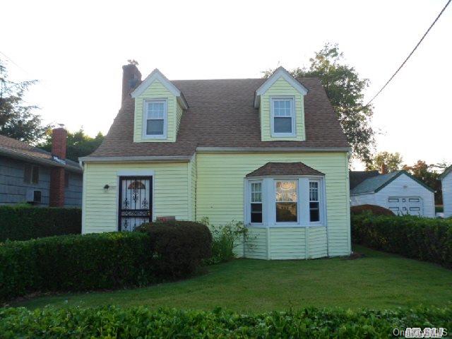 141 Rutland Road Hempstead, NY 11550 - Photo 1 of 1 a front view of a house with a garden