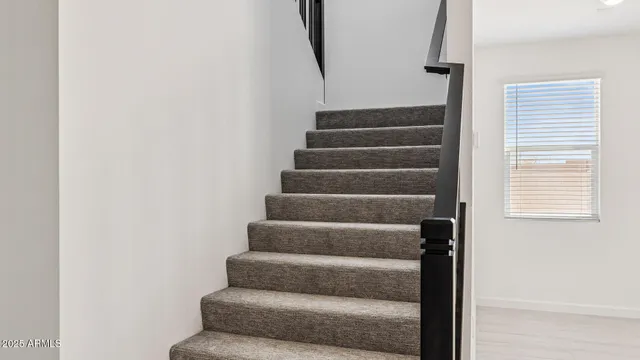 a bathroom with a double vanity sink a toilet and mirror