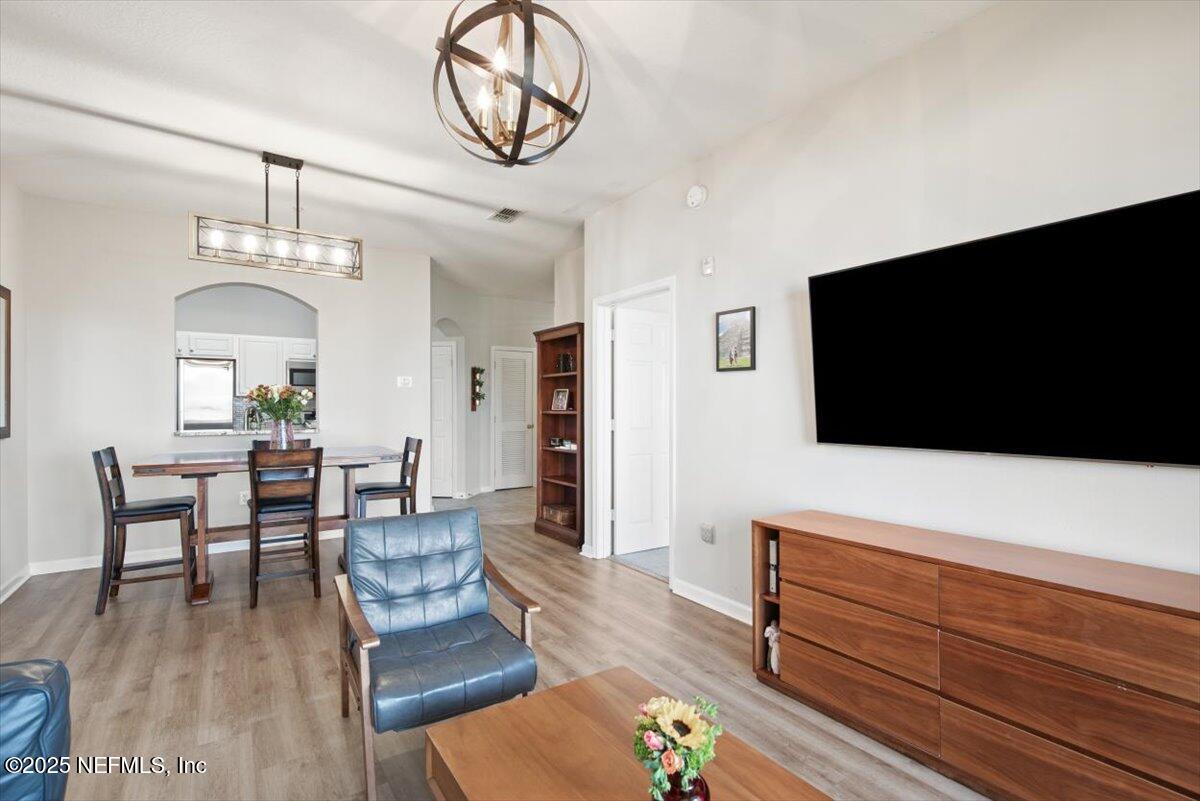 7990 Baymeadows Road East, Unit 913 Jacksonville, FL 32256 - Photo 14 of 70 a living room with furniture and a flat screen tv