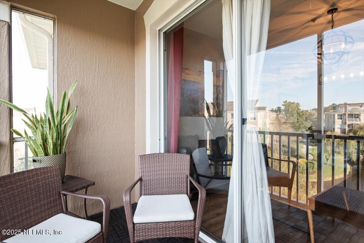 7990 Baymeadows Road East, Unit 913 Jacksonville, FL 32256 - Photo 24 of 70 a view of a balcony with chairs