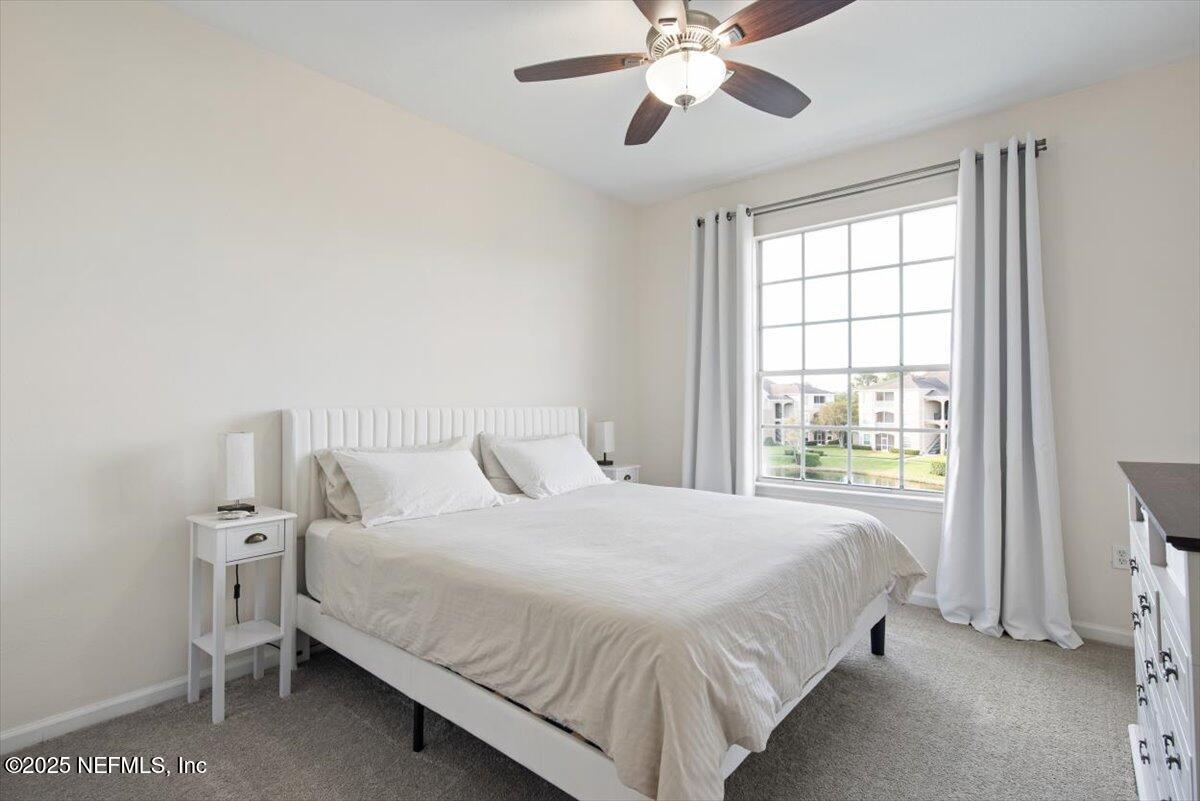 7990 Baymeadows Road East, Unit 913 Jacksonville, FL 32256 - Photo 26 of 70 a bedroom with a bed and a window
