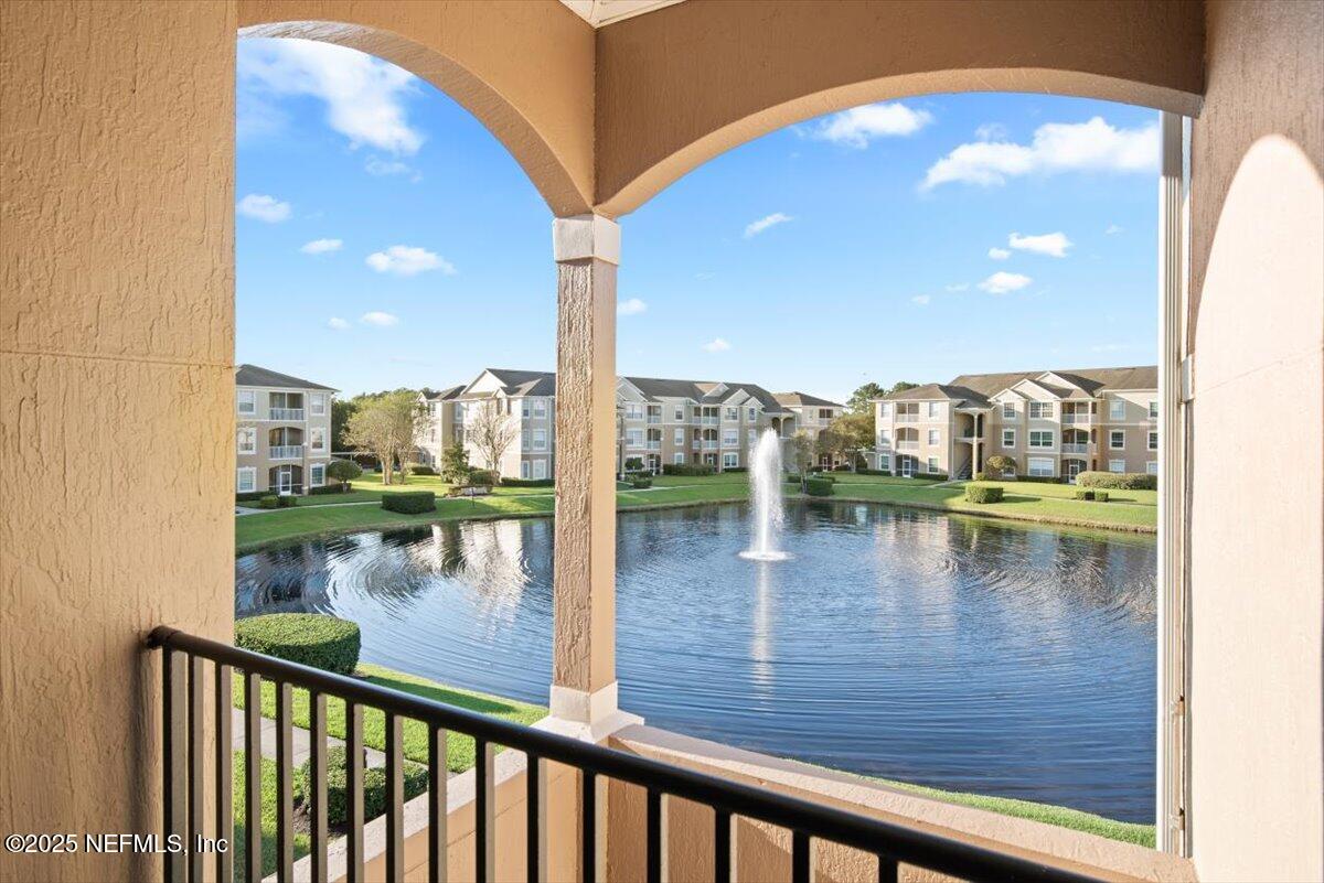7990 Baymeadows Road East, Unit 913 Jacksonville, FL 32256 - Photo 3 of 70 a view of a lake from a balcony