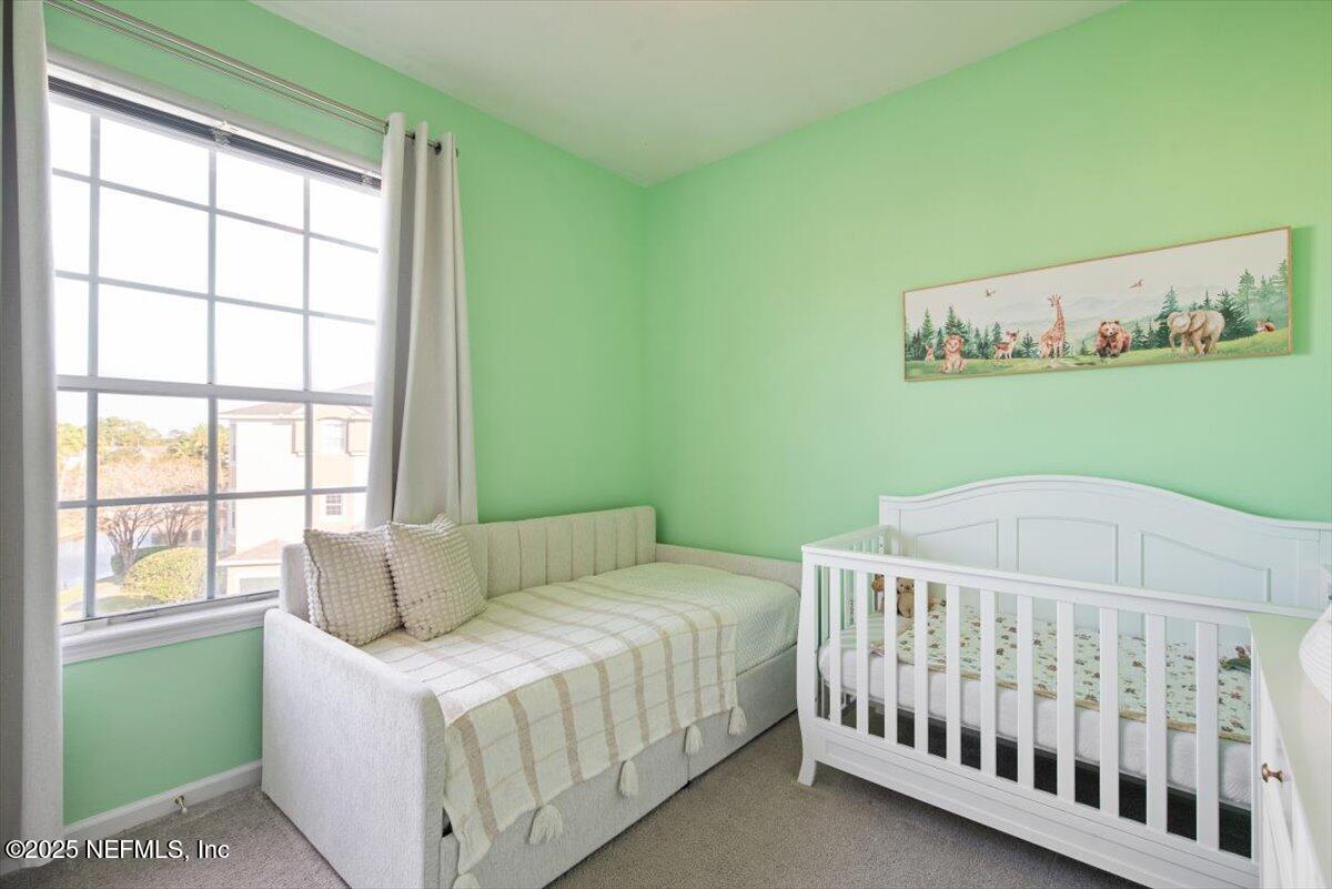 7990 Baymeadows Road East, Unit 913 Jacksonville, FL 32256 - Photo 34 of 70 a bedroom with a bed and a window