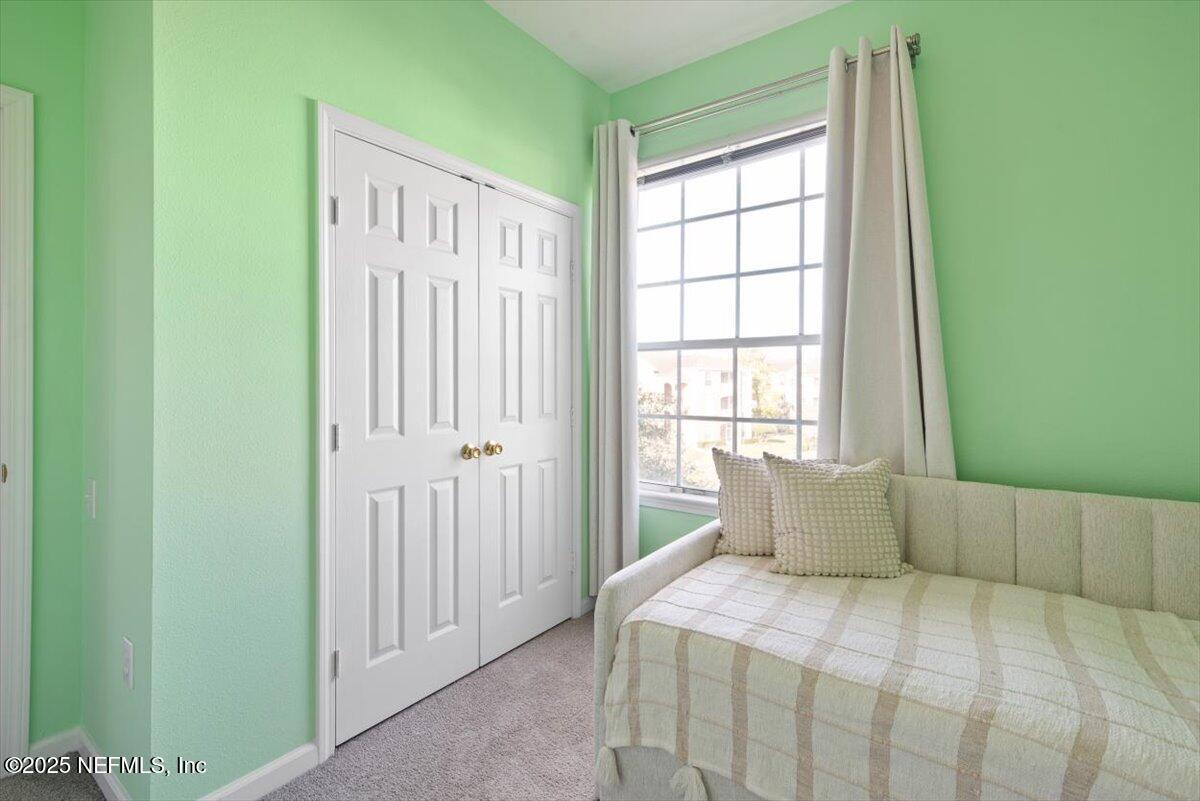 7990 Baymeadows Road East, Unit 913 Jacksonville, FL 32256 - Photo 35 of 70 a bedroom with a bed and a window