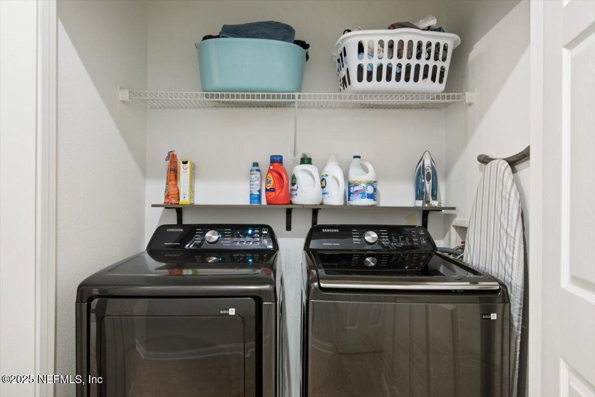7990 Baymeadows Road East, Unit 913 Jacksonville, FL 32256 - Photo 39 of 70 a kitchen with a stove and cabinets
