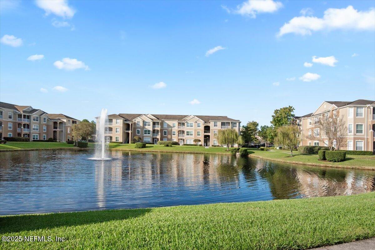 7990 Baymeadows Road East, Unit 913 Jacksonville, FL 32256 - Photo 41 of 70 a view of a lake with houses