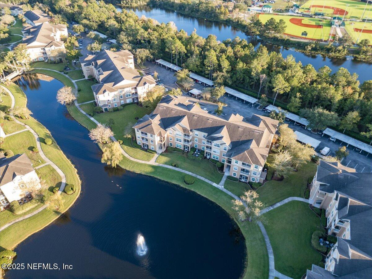 7990 Baymeadows Road East, Unit 913 Jacksonville, FL 32256 - Photo 52 of 70 an aerial view of a house with a lake view